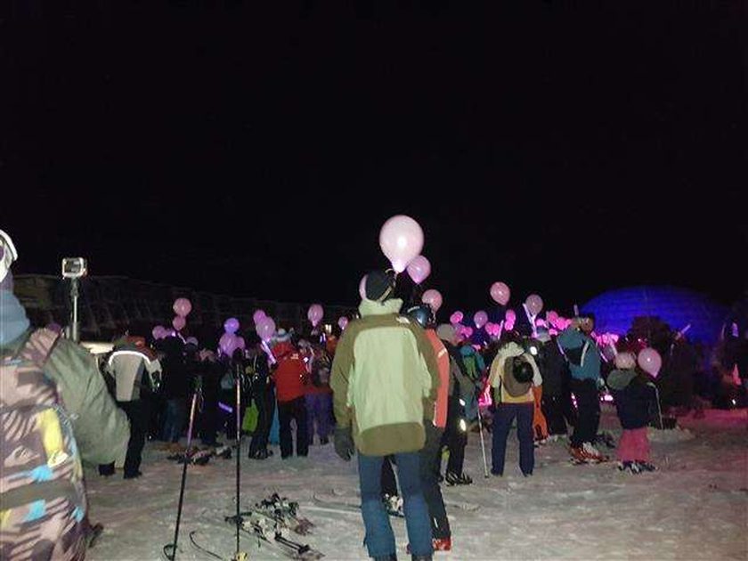 I light, skiing for breast cancer